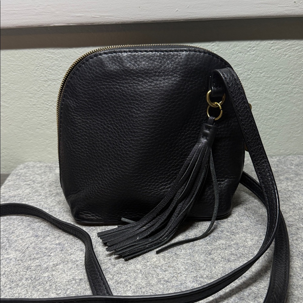 Pebbled Black Leather Hobo International Nash Crossbody Bag with Tassel